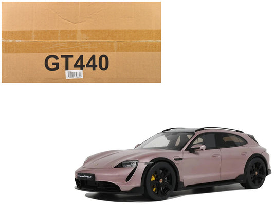Pink sports car next to a cardboard box labeled 'GT440' on a white background