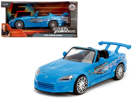 A 1/24 scale diecast model of a blue 2001 Honda S2000 Convertible from the 'Fast & Furious Remix' Series with graphics, displayed in its packaging.