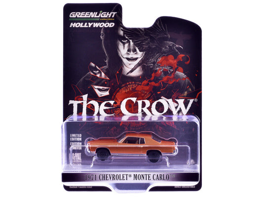 Packaged diecast model of a 1971 Chevrolet Monte Carlo in orange color, with 'The Crow' movie branding on the box.
